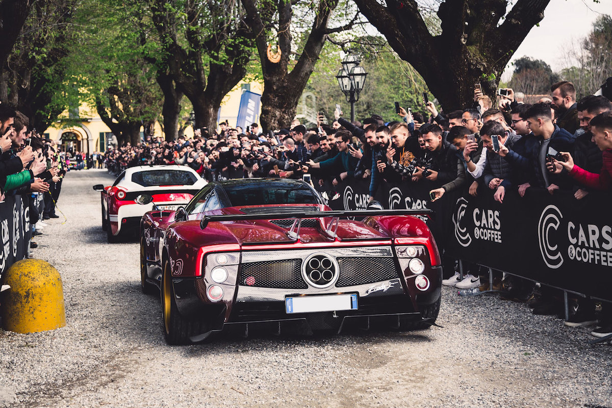 An early Cars and Coffee gathering in a European square